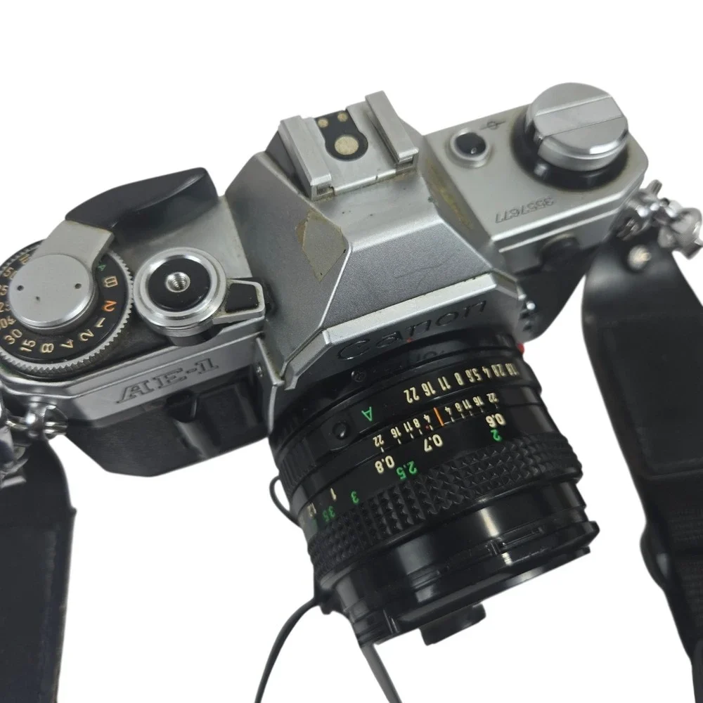 Canon AE-1 35mm SLR Film Camera w Canon 50mm f/1.8 FD Lens + Tons of Extras VID!